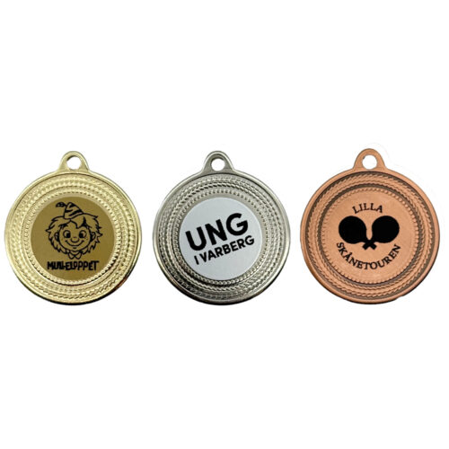 Medaljer i guld, silver och brons med eget motiv i svart färg